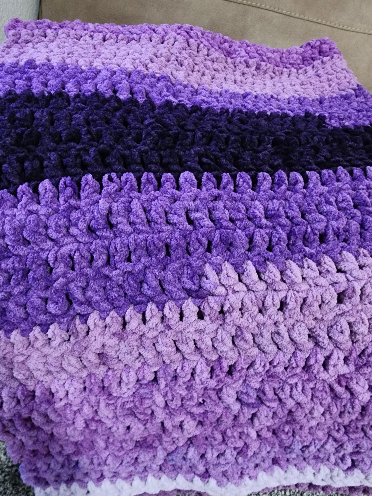 Crochet purple blanket.