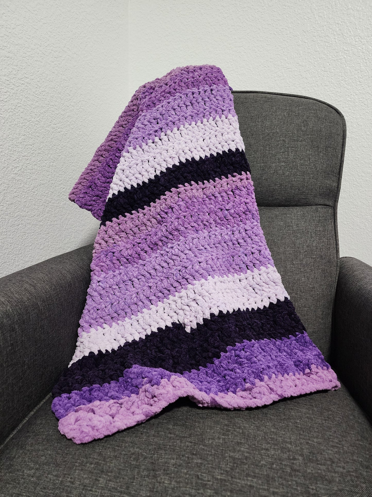 Crochet purple blanket.